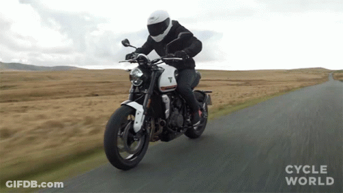 Man Riding Motorcycle On Road With Cycle World GIF