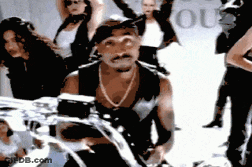 Man Riding Motorcycle Past Lous Sign GIF