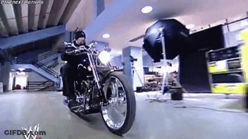 Man Riding Motorcycle With Camera GIF