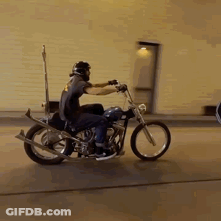 Man Riding Motorcycle With Helmet GIF