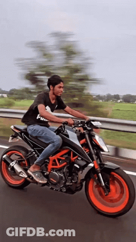Man Riding Motorcycle With KTM Shirt GIF