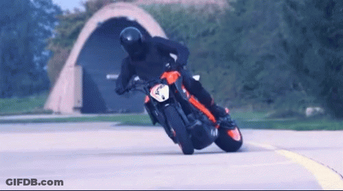 Man Riding Motorcycle With Number 4 GIF