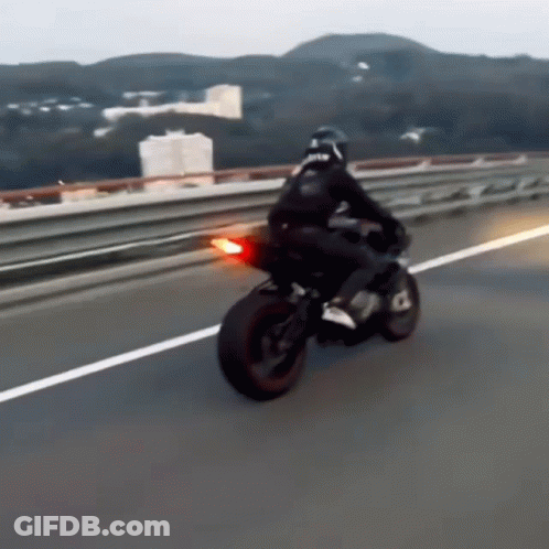 Man Riding Motorcycle With RTR On Back GIF