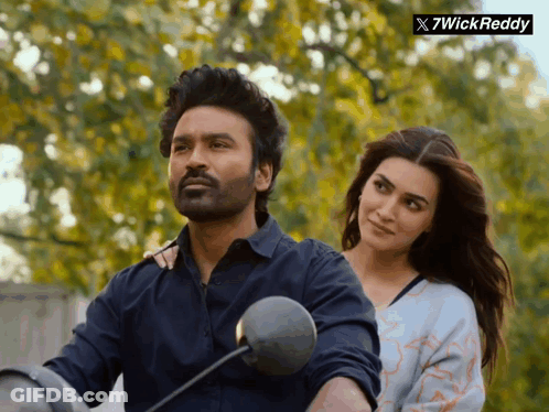 Man Riding Motorcycle With Woman Behind GIF