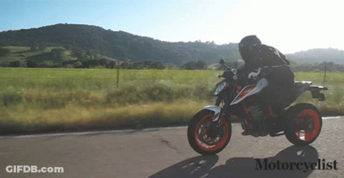 Man Riding Motorcycle With Word Motorcyclist GIF