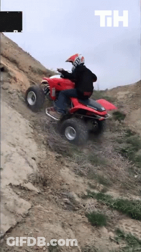 Man Riding Red Honda ATV On Dirt Road GIF