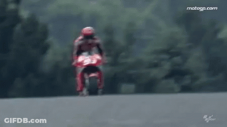 Man Riding Red Motorcycle On Track GIF
