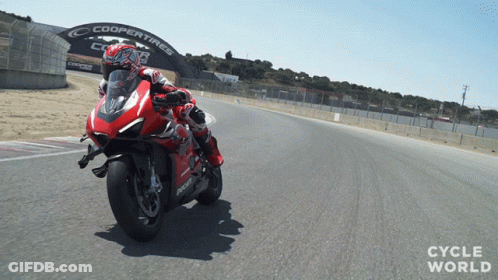 Man Riding Red Motorcycle With Coopertires Sign GIF