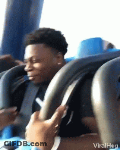 Man Riding Roller Coaster Looking At Phone GIF