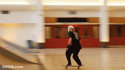 Man Riding Skateboard In Building GIF