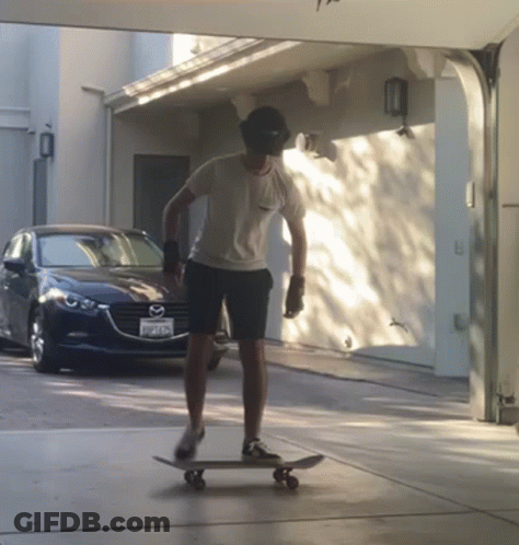 Man Riding Skateboard In Front Of Mazda GIF