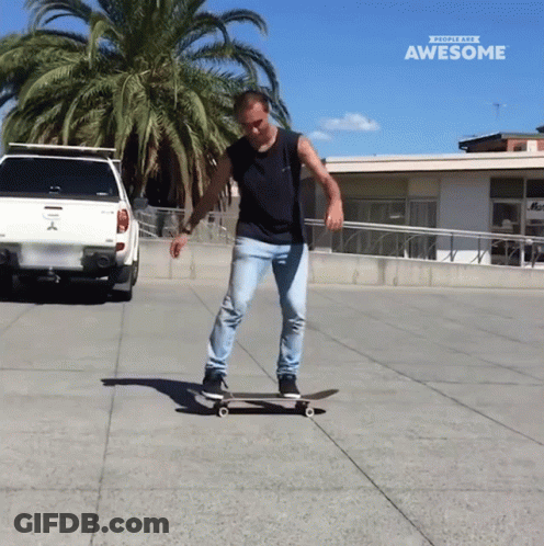 Man Riding Skateboard In Front Of Truck Saying Awesome GIF