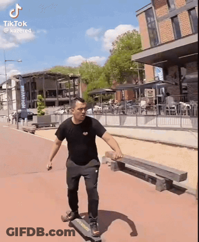 Man Riding Skateboard Past Brewery Sign GIF