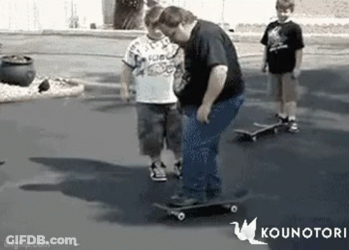 Man Riding Skateboard With Two Boys GIF