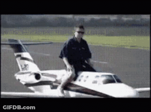 Man Riding Small Airplane LK GIF