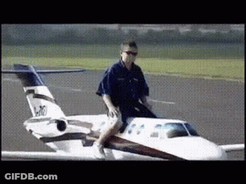 Man Riding Small Airplane N470 GIF