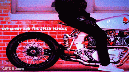Man Riding Yamaha Motorcycle By Brick Wall GIF