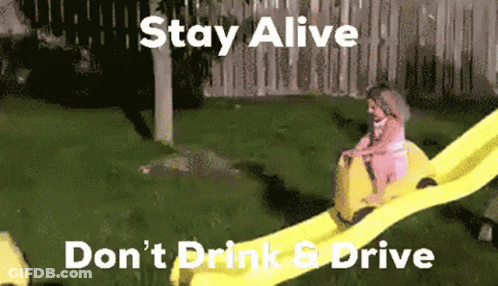 Man Riding Yellow Water Slide Stay Alive Don't Drink & Drive GIF