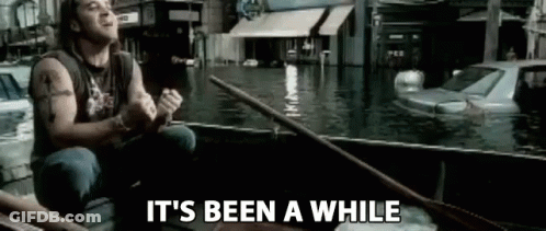 Man Rowing Boat Through Flooded City GIF