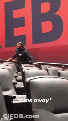 Man Running Away From Red Sign Saying EB GIF