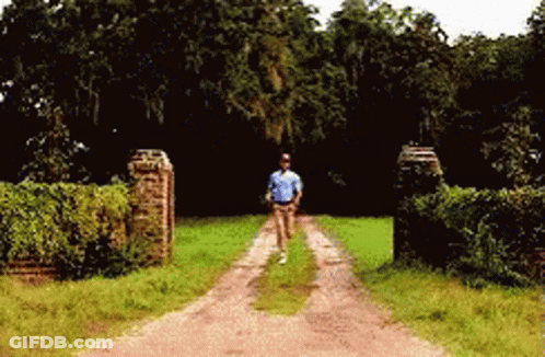 Man Running Down Dirt Road GIF