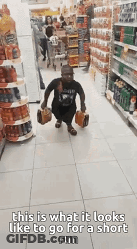Man Running Down Grocery Store Aisle With Briefcase And Bag GIF