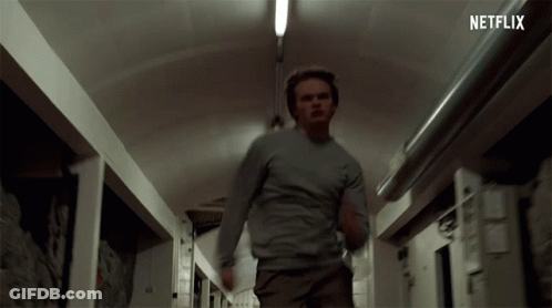 Man Running Down Hallway With Netflix Logo GIF
