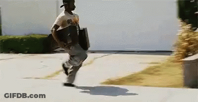 Man Running Down Sidewalk With Briefcase GIF