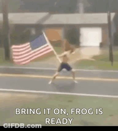 Man Running Down Street With American Flag GIF