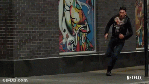 Man Running Down Street With Netflix Logo GIF