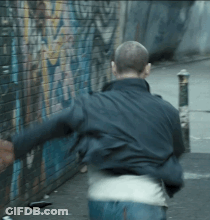 Man Running In Front Of Graffiti Wall GIF