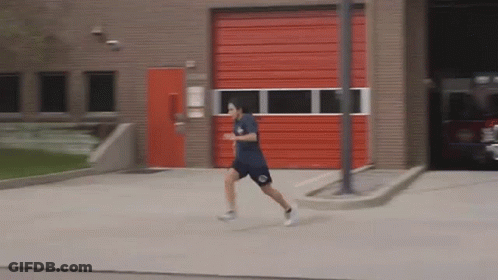 Man Running In Front Of Red Door GIF