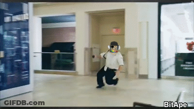 Man Running In Hallway With Exit Sign GIF