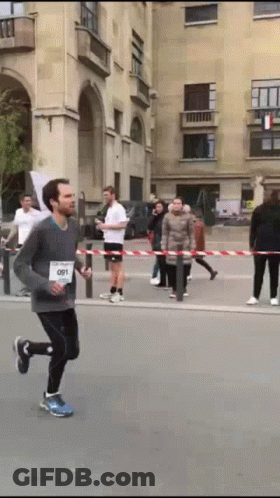 Man Running In Race With 091 On Shirt GIF