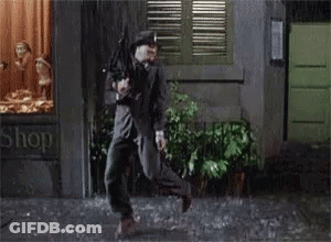 Man Running In Rain Past Store Saying Shop GIF