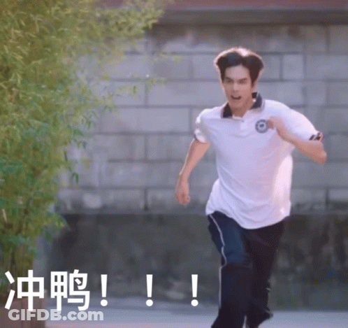Man Running In White Shirt Near Brick Wall GIF