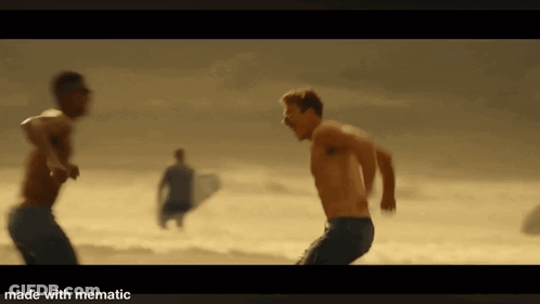 Man Running On Beach With Surfboard GIF