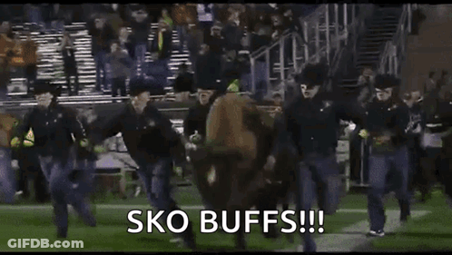 Man Running On Football Field With Banner GIF