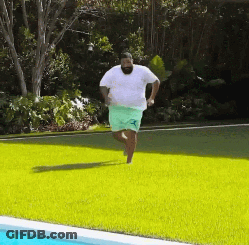 Man Running On Green Lawn GIF