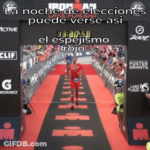 Man Running On Red Carpet In Front Of Ironman Sign GIF