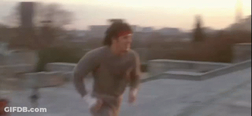 Man Running On Rooftop GIF