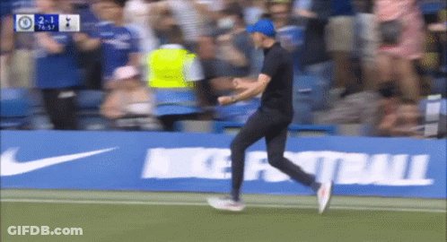 Man Running On Soccer Field Near Nike Football Ad GIF