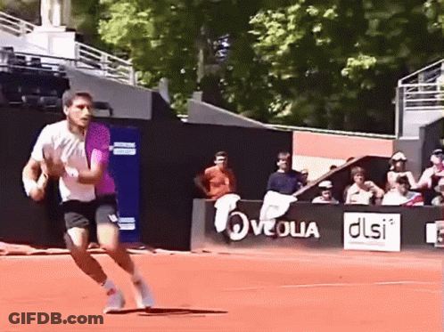 Man Running On Tennis Court With DLSI Sign GIF