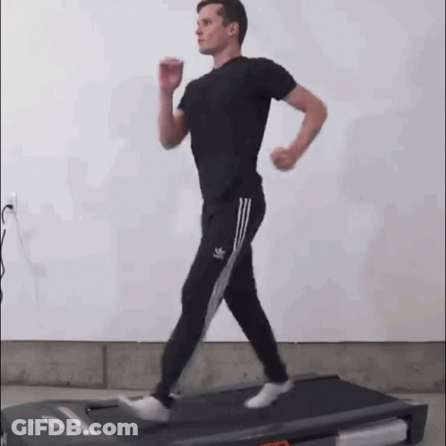 Man Running On Treadmill In Gym GIF