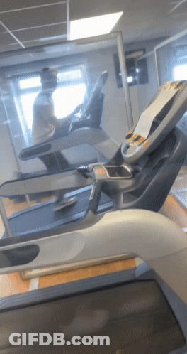 Man Running On Treadmill In Gym GIF