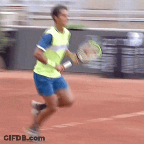 Man Running Tennis Racquet In Yellow And Blue GIF