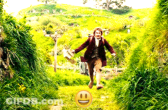 Man Running Through Grassy Field With Smiley Face GIF