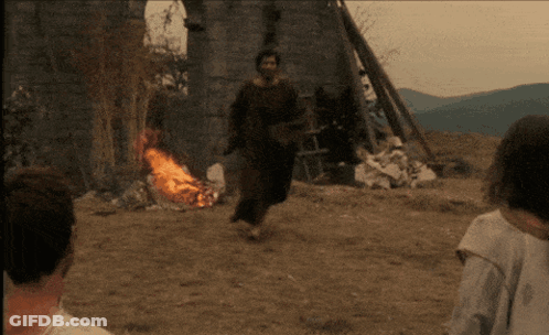 Man Running Towards Burning Fire GIF