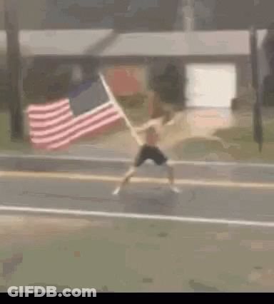 Man Running With American Flag Behind GIF