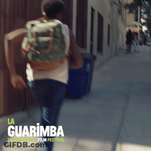 Man Running With Backpack At La Guarimba Film Festival GIF